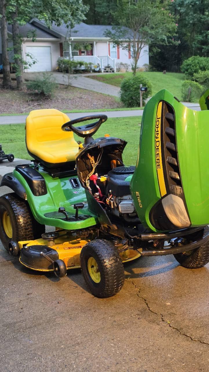 John Deere E160 riding mower with its hood open
